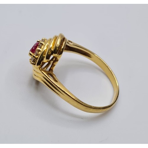 322 - 18ct yellow gold diamond & ruby ring, weight 4.4g. Size P