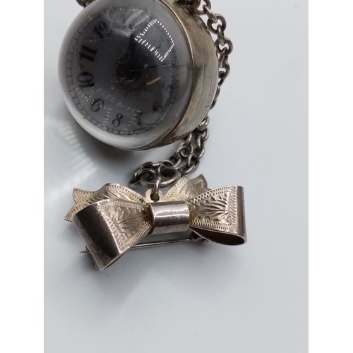 548 - A Ladies Antique Pendant Ball Watch with Magnified Works to the Back and Ornate Face and Silver Bow ... 