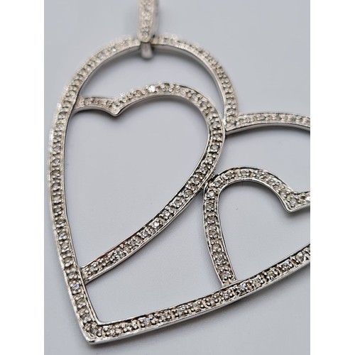 491 - 18CT WHITE GOLD LARGE OPEN DIAMOND SET HEART PENDANT, WEIGHT 5.8G & 0.50CT APPROX. LENGTH 5.5CMS