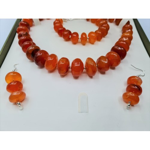 83 - A highly polished carnelian and silver (stamped 