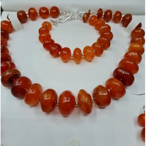 83 - A highly polished carnelian and silver (stamped 