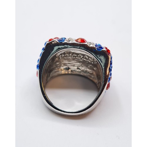 78 - A silver (stamped 925) ring with red, blue and clear gems set as a Union Jack. Ring size: 7 Total we... 