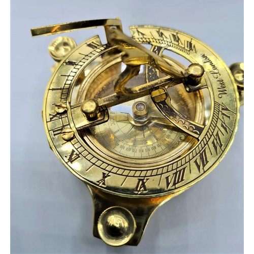 61 - A British miniature marine sundial with compass and adjustable feet in excellent working order in a ... 