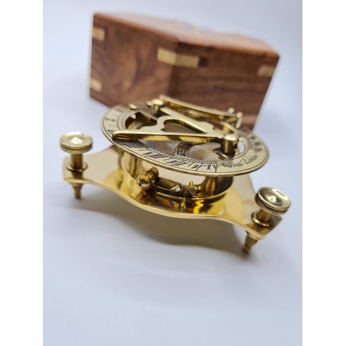 61 - A British miniature marine sundial with compass and adjustable feet in excellent working order in a ... 