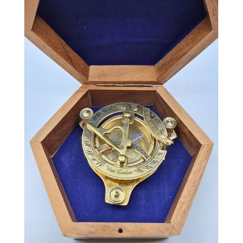 61 - A British miniature marine sundial with compass and adjustable feet in excellent working order in a ... 