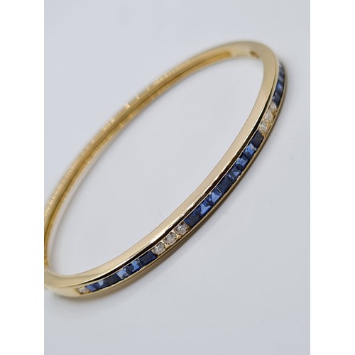 4 - 18CT YELLOW GOLD DIAMOND & SAPPHIRE CHANNEL SET BANGLE, WEIGHT 15G & 0.25CT APPROX