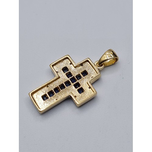 56 - 9CT YELLOW GOLD DIAMOND & SAPPHIRE CROSS, WEIGHT 2.8G