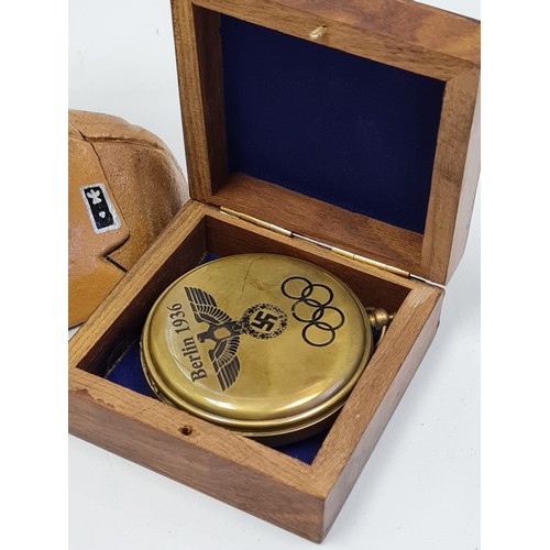 12 - Memorabilia from Berlin 1936 Olympic games 
A cased brass compass with the 