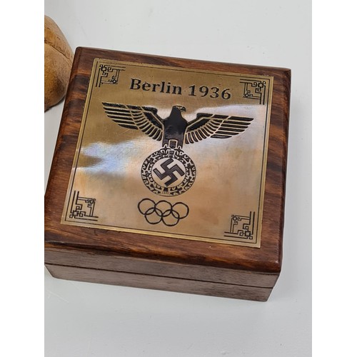 12 - Memorabilia from Berlin 1936 Olympic games 
A cased brass compass with the 