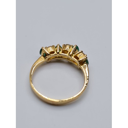 183 - 18CT YELLOW GOLD DIAMOND & EMERALD 7 STONE RING, WEIGHT 2.2G. Size I/J