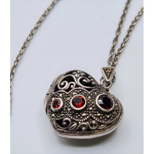 212 - STERLING SILVER GARNET SET VINTAGE LOCKET ON CHAIN