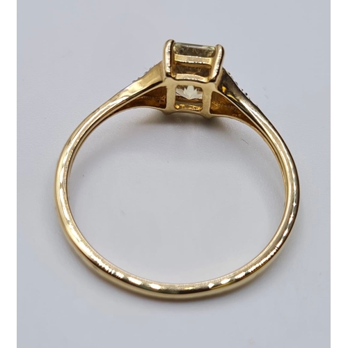 126 - 9ct Yellow Gold Stone Set Ring Having a Centre Topaz and With 4 Delicate Diamonds to Each Shoulder. ... 