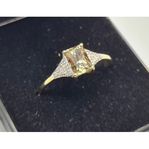 126 - 9ct Yellow Gold Stone Set Ring Having a Centre Topaz and With 4 Delicate Diamonds to Each Shoulder. ... 