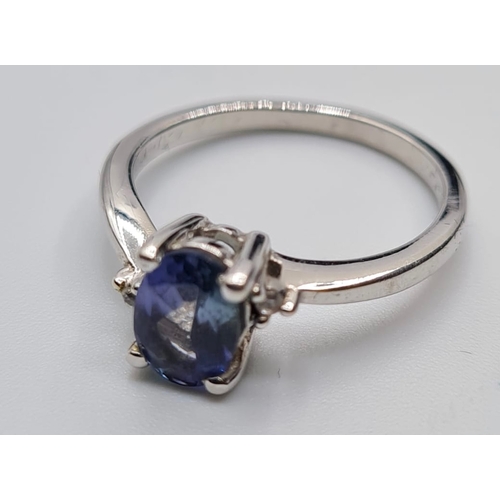 132 - 9ct White Gold Stone Set Ring Having a Blue Topaz Oval Solitaire in a Four Claw Mount. Full UK Hallm... 