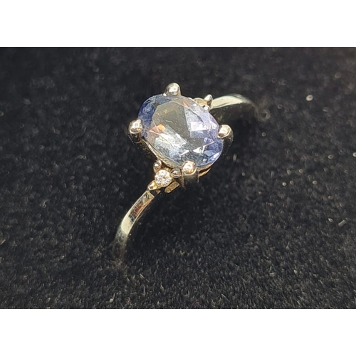 132 - 9ct White Gold Stone Set Ring Having a Blue Topaz Oval Solitaire in a Four Claw Mount. Full UK Hallm... 