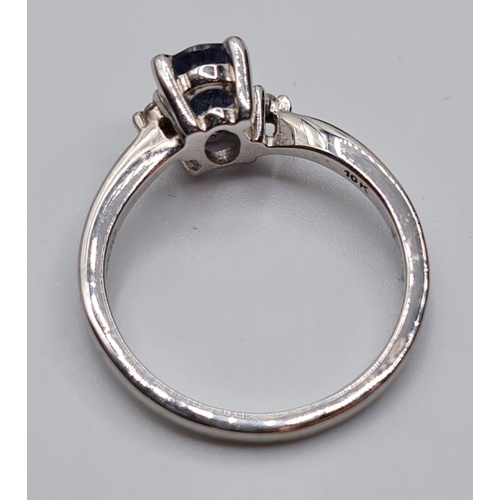 132 - 9ct White Gold Stone Set Ring Having a Blue Topaz Oval Solitaire in a Four Claw Mount. Full UK Hallm... 