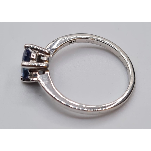 132 - 9ct White Gold Stone Set Ring Having a Blue Topaz Oval Solitaire in a Four Claw Mount. Full UK Hallm... 