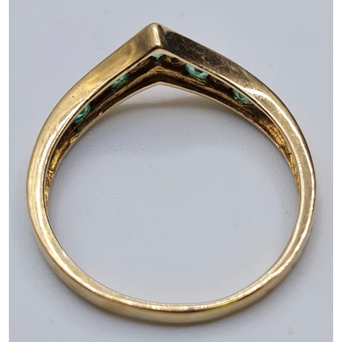 168 - 9ct gold ring with diamond and peridot stones to top. London hallmark wishbone form. Size N1/2