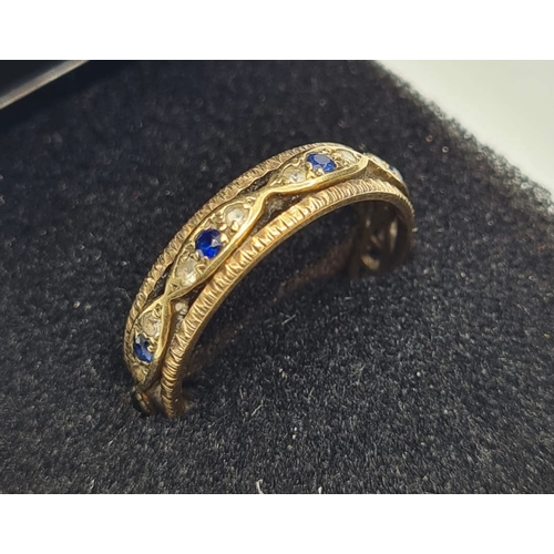 170 - 9ct gold full eternity ring with clear stones and sapphires. Size O/P. 3.1g approx hallmarked inside... 