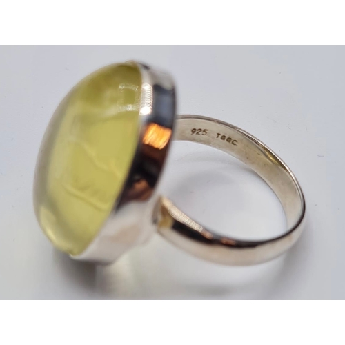 269 - Large Silver Stone Set Ring. Pale Citrine Having a ‘Cupid’s Bow’ Inside the Stone in an ‘Intaglio’ T... 