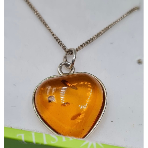 366 - Silver Mounted Heart Shaped Amber Pendant on a Silver Chain. Chain 45cm Approx, Stamped 925 Silver.