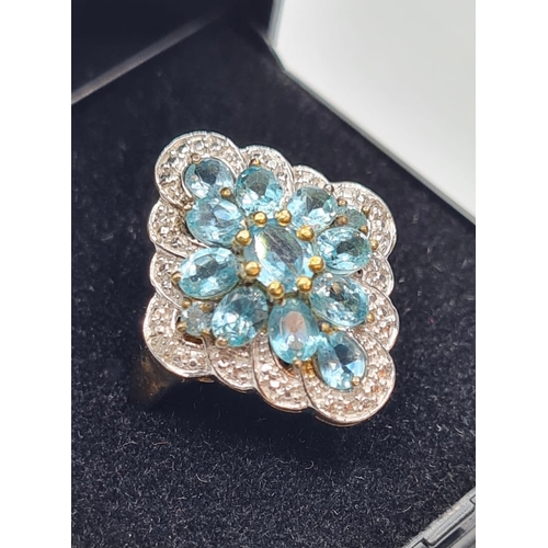 417 - Stone Set Silver Cluster Ring Having Blue Green Topaz Coloured Stones with Silver Beading Border to ... 