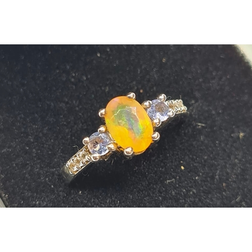 425 - Stone Set Silver Ring Having a Pale Orange Stone with a Sapphire Coloured Stone to Each Side of Moun... 