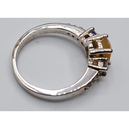 425 - Stone Set Silver Ring Having a Pale Orange Stone with a Sapphire Coloured Stone to Each Side of Moun... 