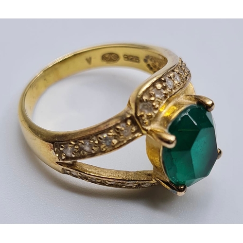 432 - Silver Ring Having Oval Green Stone to Top and Zirconia's Surround on 'V' Shaped Shoulders. Silver h... 