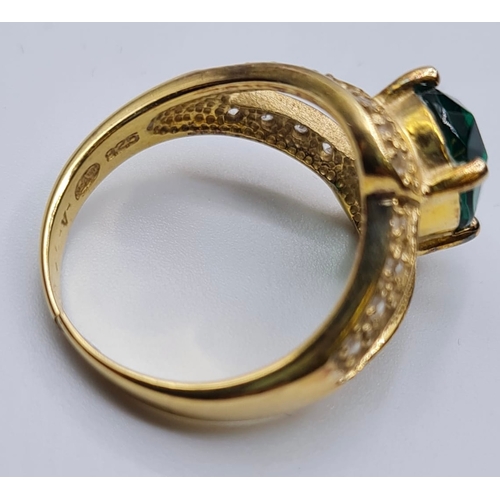 432 - Silver Ring Having Oval Green Stone to Top and Zirconia's Surround on 'V' Shaped Shoulders. Silver h... 