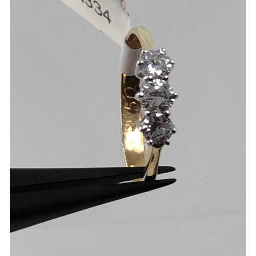 478 - 18k yellow gold ring with 0.65ct diamond trilogy, weight 2.6g and size P (ecn334)