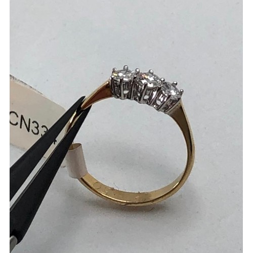 478 - 18k yellow gold ring with 0.65ct diamond trilogy, weight 2.6g and size P (ecn334)