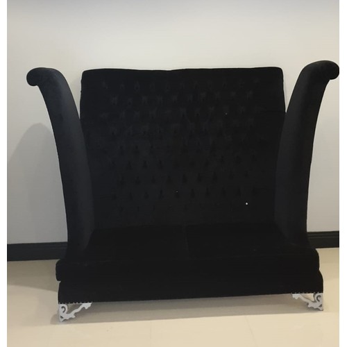 98 - A designer button backed 2 seater sofa in black velvet. Designed by Roche Bobois and measures 150cm ... 