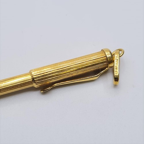 72 - 18ct gold novelty pen pendant, weight 5.5g and length 5cms