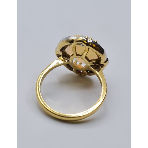 144 - Opel and diamond ring set in 18ct gold, weight 5.7g & Size M