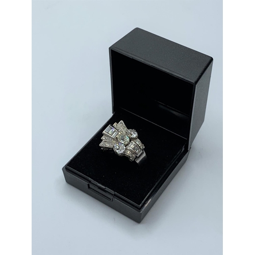 102 - 3x 0.39ct pear shaped Diamonds flanked by 1ct graduated baguette and 2ct of small round cut diamonds... 