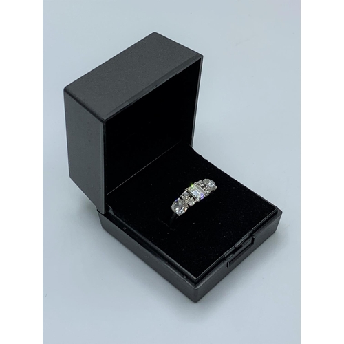 104 - White Gold ring 18 ct  having a Quality emerald cut 0.50ct centre diamond flanked by 2x 0.50ct old f... 