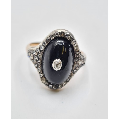 10 - Antique diamond encrusted black enamel ring with small centre diamonds,5 grams & size M.