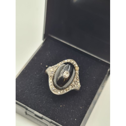 10 - Antique diamond encrusted black enamel ring with small centre diamonds,5 grams & size M.