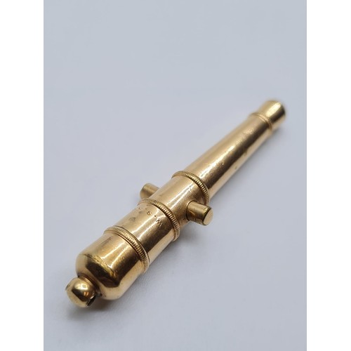 82 - 9ct gold miniature cannon lighter, weight 7.2g and length 5cms