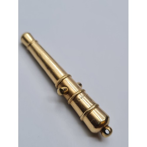 82 - 9ct gold miniature cannon lighter, weight 7.2g and length 5cms