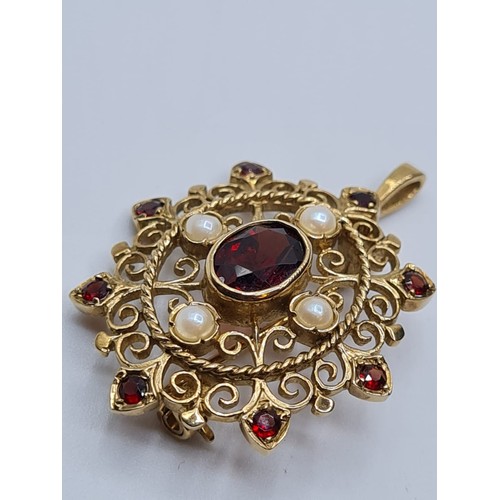 71 - Victorian  9ct gold pendant with seed pearls and garnets. weight 4.8g and length 3cms