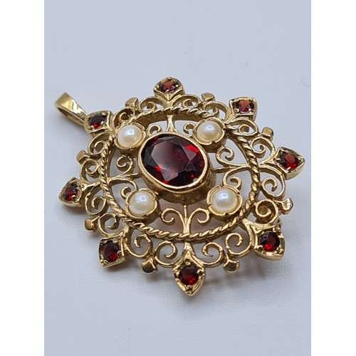 71 - Victorian  9ct gold pendant with seed pearls and garnets. weight 4.8g and length 3cms