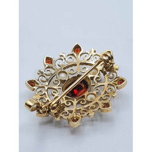 71 - Victorian  9ct gold pendant with seed pearls and garnets. weight 4.8g and length 3cms