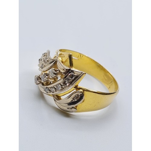 57 - 18ct gold ring with inset diamonds and diamond trilogy centre. weight 5.4g and size S