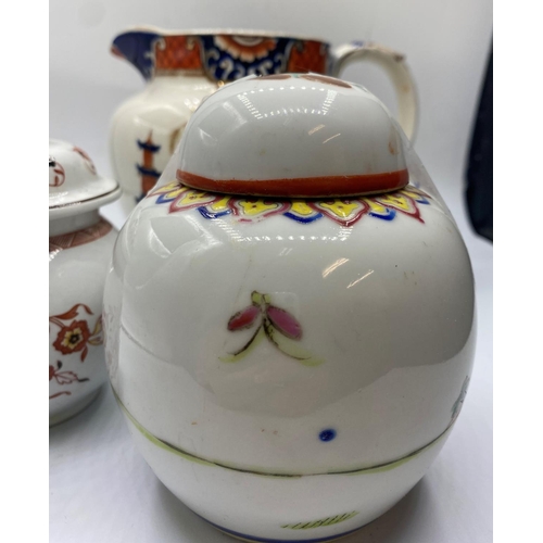 600 - An Oriental themed Jug and Lidded pot with a Wedgwood lidded pot (3)