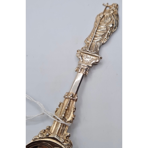 135 - A 1901 Hallmarked Ornate Cathedral Spoon 44.8g, 18cms.