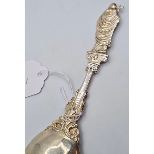 135 - A 1901 Hallmarked Ornate Cathedral Spoon 44.8g, 18cms.