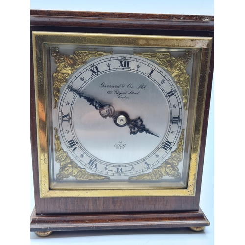 20 - A Garrard & Co LTD of Regent Street Wooden Mantle Clock with Ornate Face and Works by Elliott. Circa... 