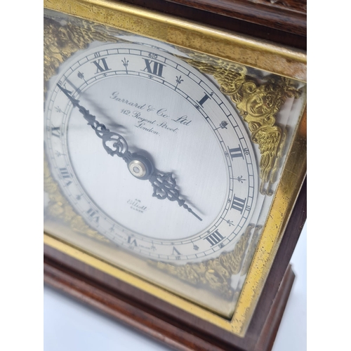 20 - A Garrard & Co LTD of Regent Street Wooden Mantle Clock with Ornate Face and Works by Elliott. Circa... 